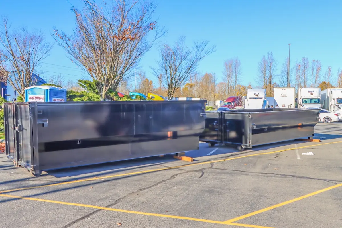 Professional dumpster rental service with roll-off container on residential driveway in North Fort Myers